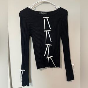 Chic Black Top with White Ribbon Accents